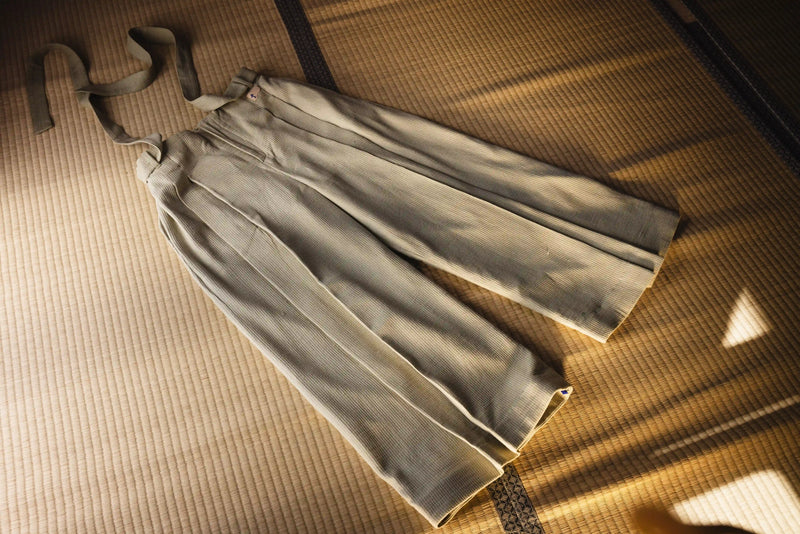 Light-colored skirt on a textured surface