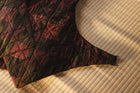 Quilted fabric with geometric pattern on a textured surface